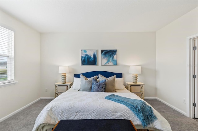 carpeted bedroom featuring baseboards