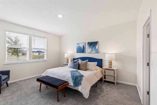 bedroom with carpet flooring and baseboards