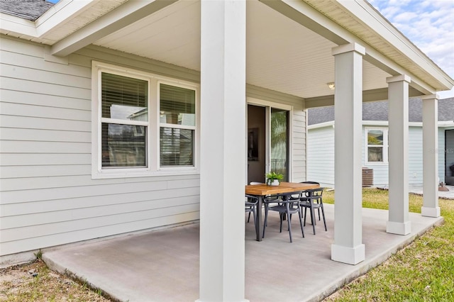 view of patio featuring outdoor dining area