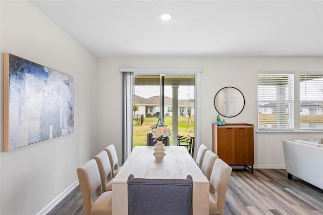 dining room featuring baseboards and wood finished floors