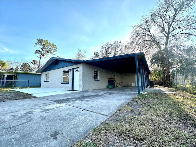 view of property exterior with a carport