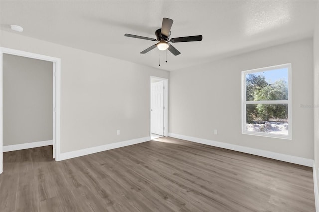 unfurnished room featuring wood-type flooring and ceiling fan