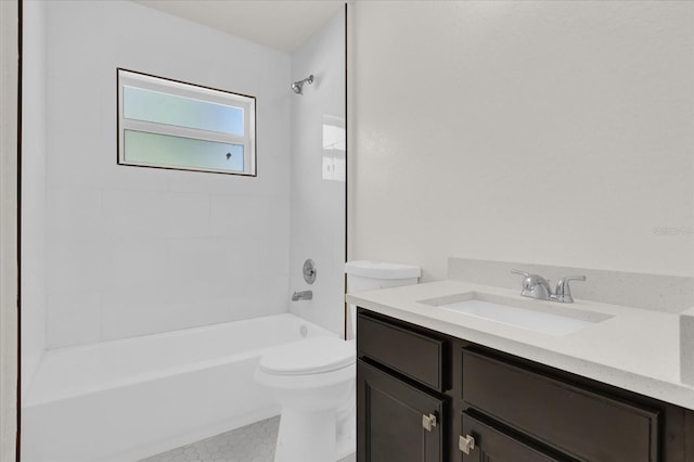 full bathroom with vanity, tiled shower / bath, and toilet