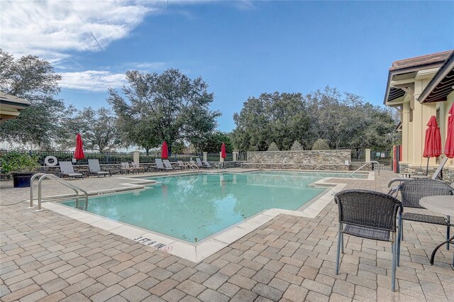 view of swimming pool featuring a patio