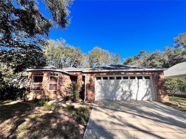 single story home with a garage