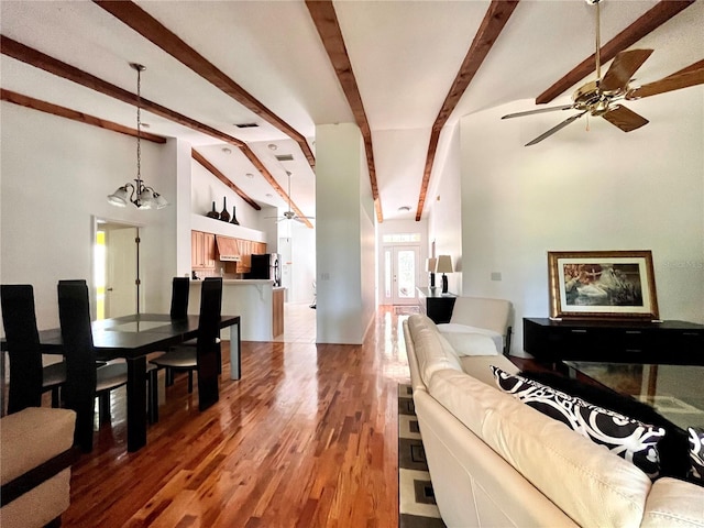 living room with high vaulted ceiling, ceiling fan with notable chandelier, hardwood / wood-style floors, and beam ceiling