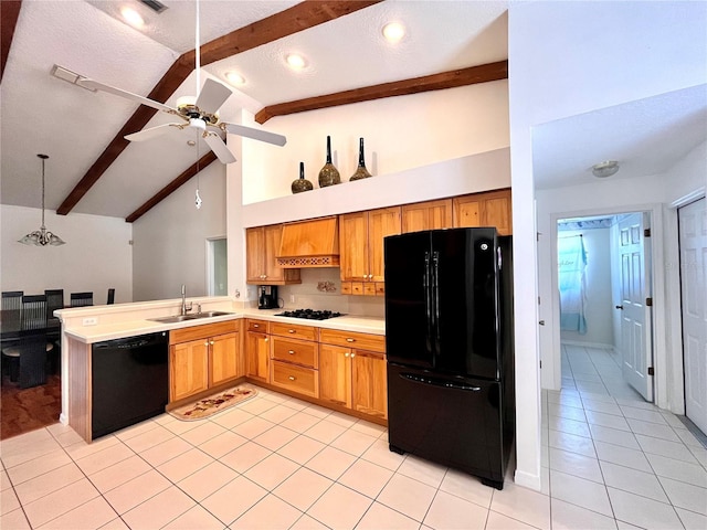 kitchen featuring pendant lighting, beamed ceiling, sink, light tile patterned floors, and black appliances