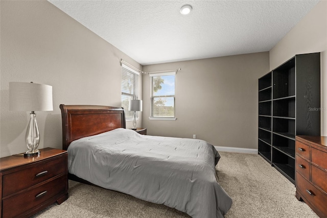 carpeted bedroom with a textured ceiling