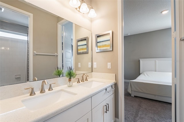 bathroom with vanity and a textured ceiling