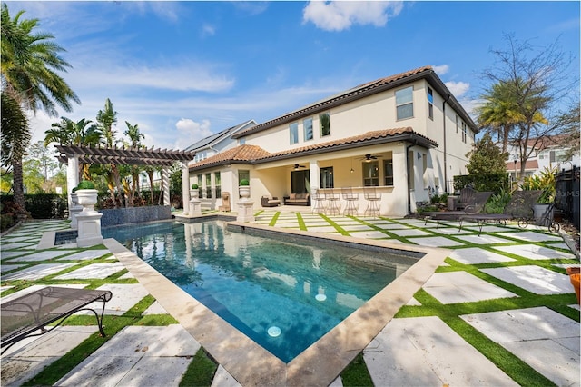 back of property featuring a pergola, a patio area, an outdoor bar, and ceiling fan