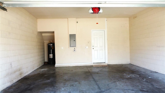 garage featuring a garage door opener, electric panel, and electric water heater