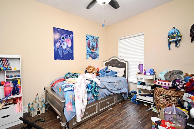 bedroom with dark hardwood / wood-style floors and ceiling fan