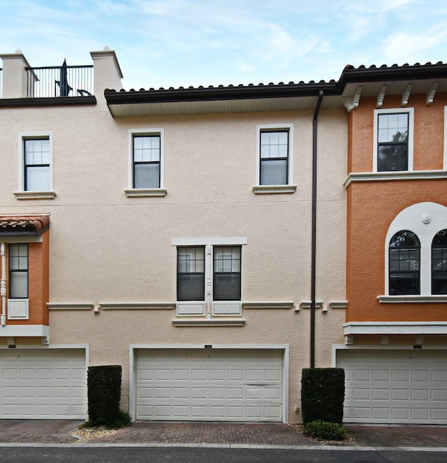 view of side of home with a garage