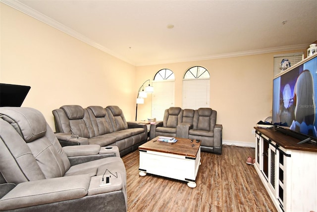 living room featuring hardwood / wood-style flooring and crown molding