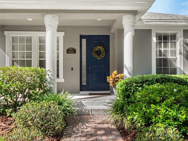 doorway to property featuring covered porch