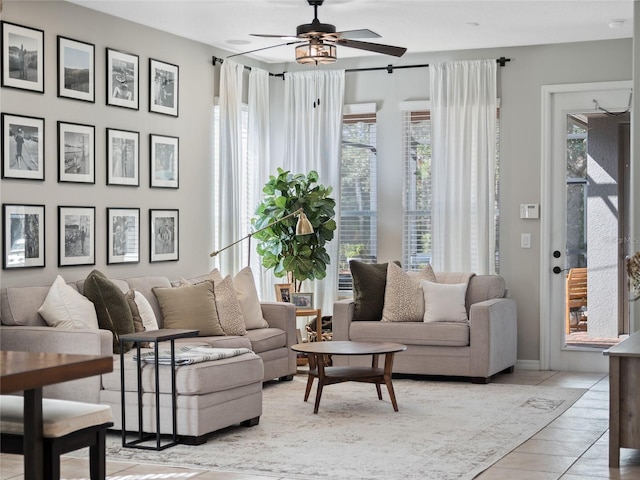 living room with a wealth of natural light and ceiling fan