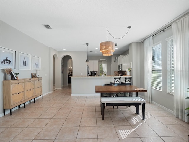 dining space with light tile patterned floors