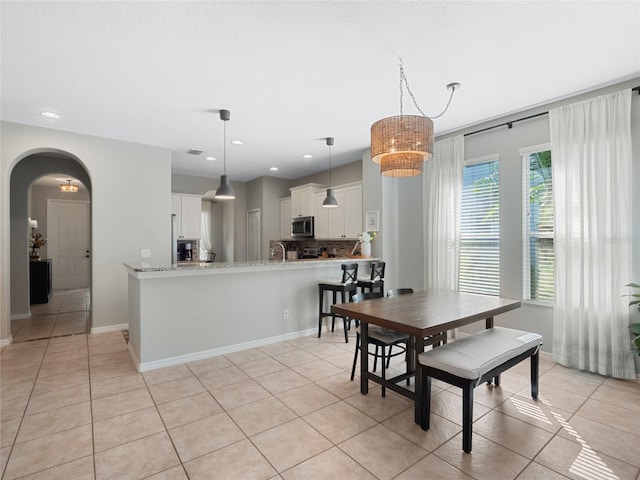 dining area with light tile patterned flooring