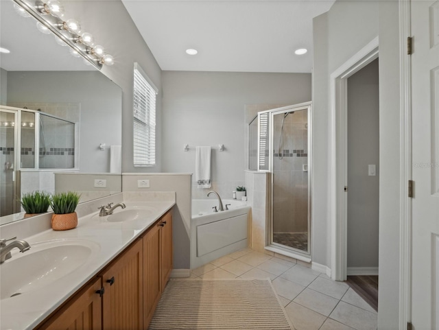 bathroom featuring tile patterned flooring, vanity, and separate shower and tub