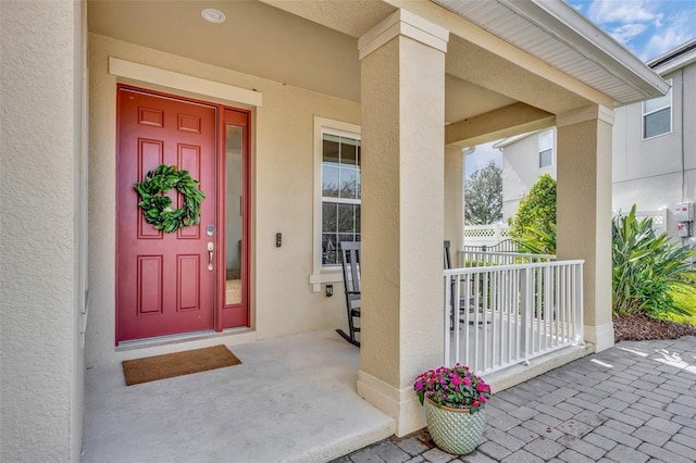 entrance to property with a porch