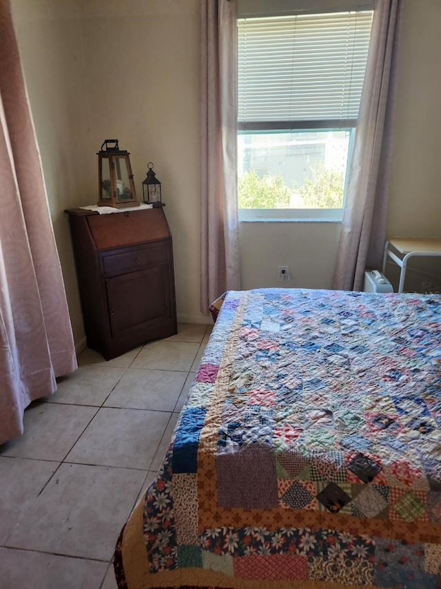 bedroom featuring light tile patterned floors