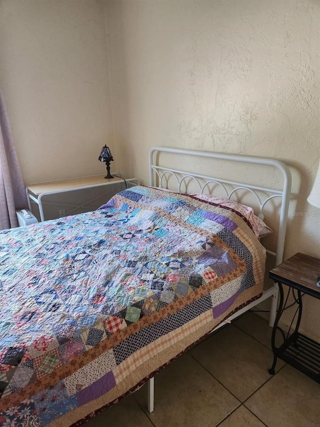 bedroom with tile patterned floors