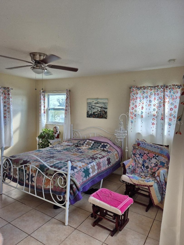 tiled bedroom with ceiling fan