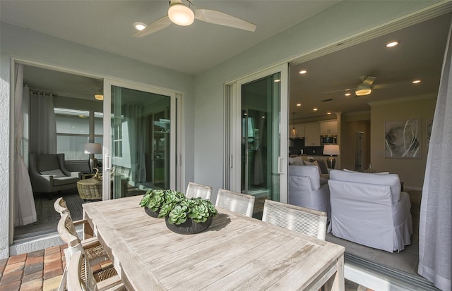 sunroom / solarium with ceiling fan