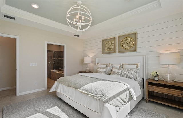 tiled bedroom featuring ornamental molding, an inviting chandelier, and a tray ceiling