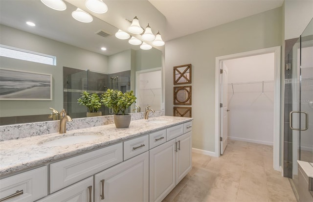 bathroom featuring walk in shower and vanity