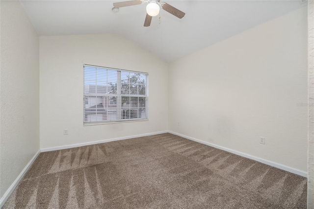 carpeted spare room with lofted ceiling and ceiling fan