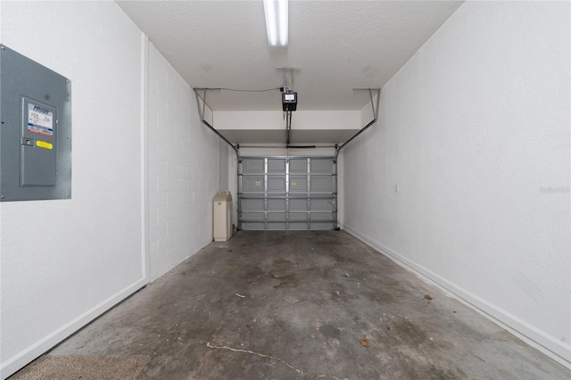 garage featuring a garage door opener and electric panel