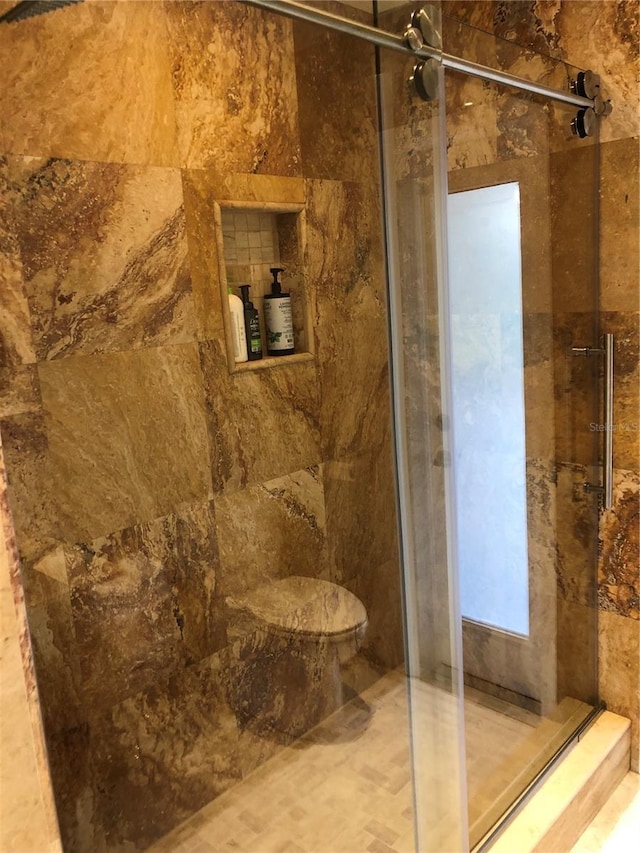 bathroom with an enclosed shower