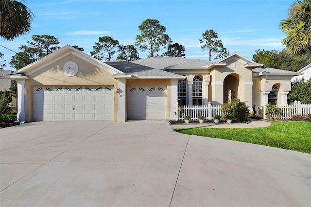 ranch-style house featuring a garage