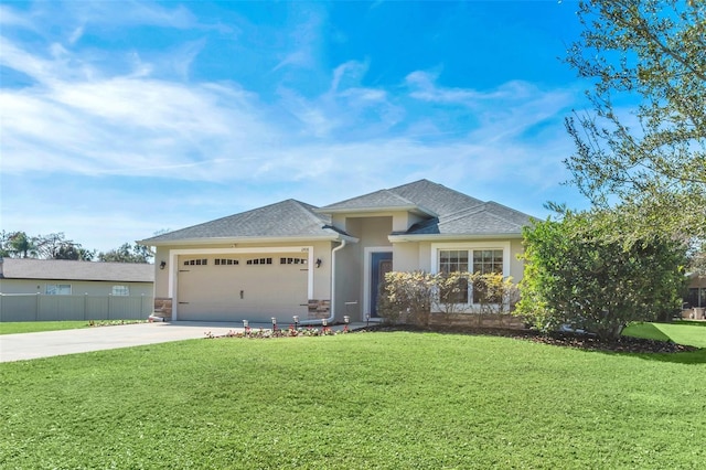 view of front of property with a garage and a front yard