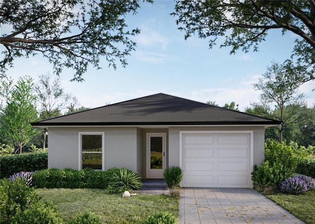 single story home featuring a garage and a front yard