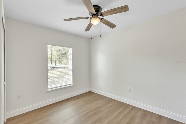 unfurnished room featuring light hardwood / wood-style floors and ceiling fan