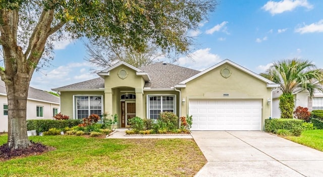 single story home with an attached garage, driveway, a front lawn, and stucco siding