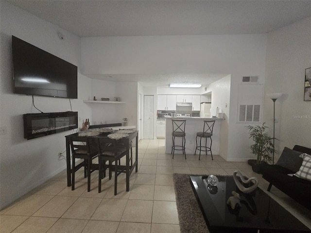 dining space with light tile patterned floors