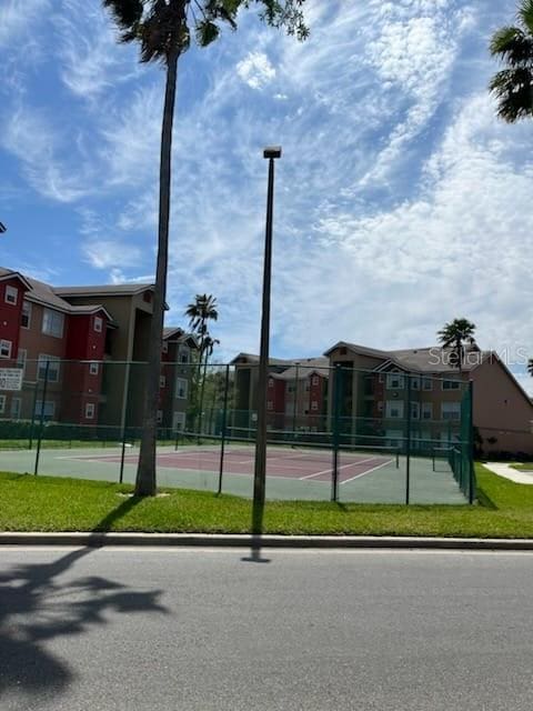 exterior space with tennis court