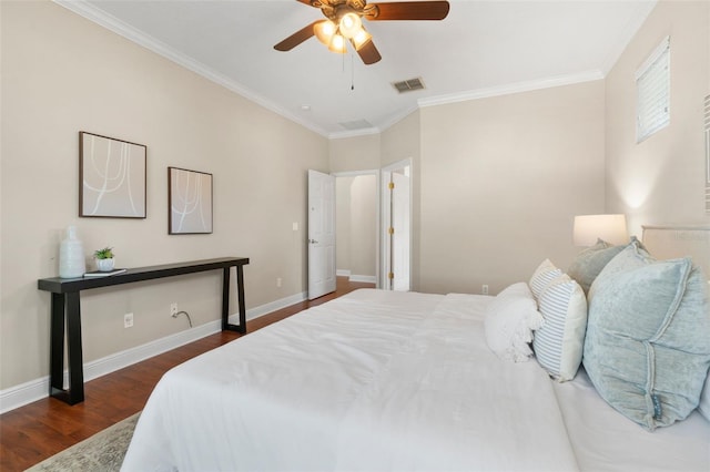 bedroom featuring ornamental molding, dark hardwood / wood-style floors, and ceiling fan