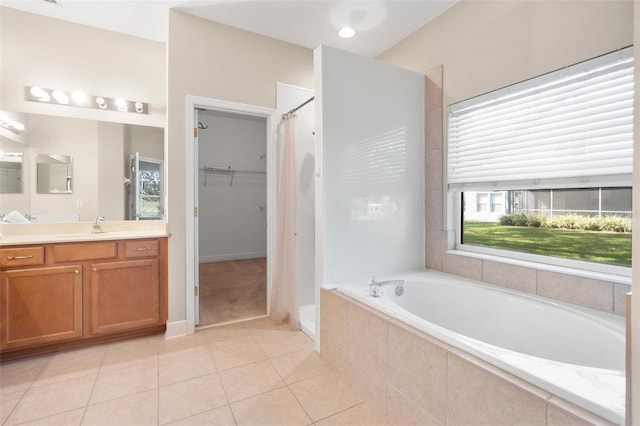 bathroom with vanity, separate shower and tub, and tile patterned floors