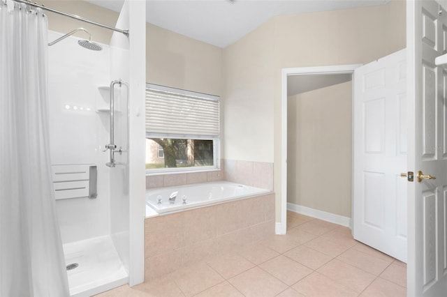 bathroom with plus walk in shower and tile patterned flooring