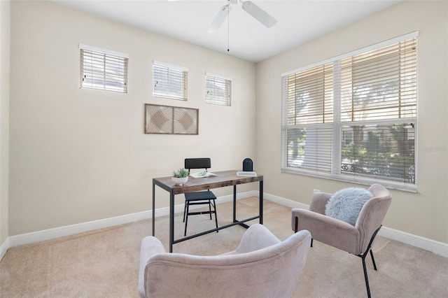 carpeted home office with ceiling fan