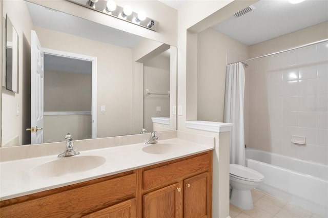 full bathroom featuring shower / tub combo, vanity, tile patterned floors, and toilet