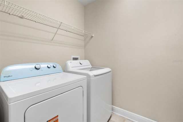 washroom with washer and dryer