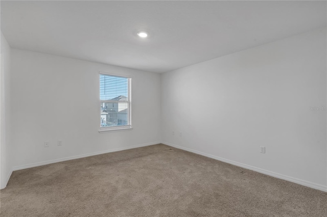 spare room with carpet flooring