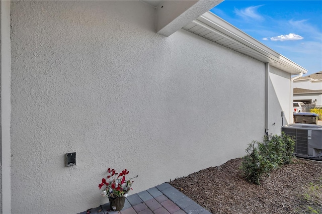 view of side of home with cooling unit