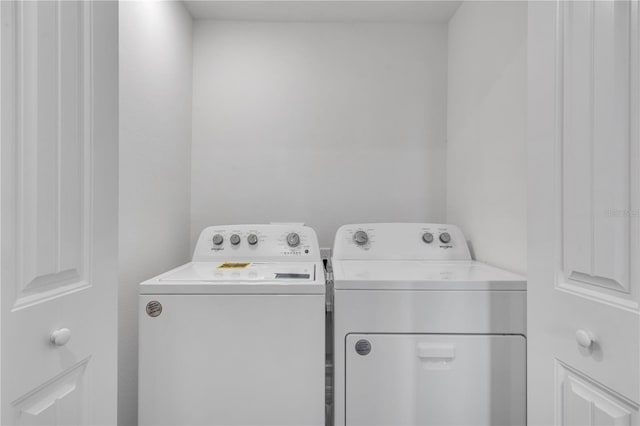 clothes washing area featuring washing machine and clothes dryer