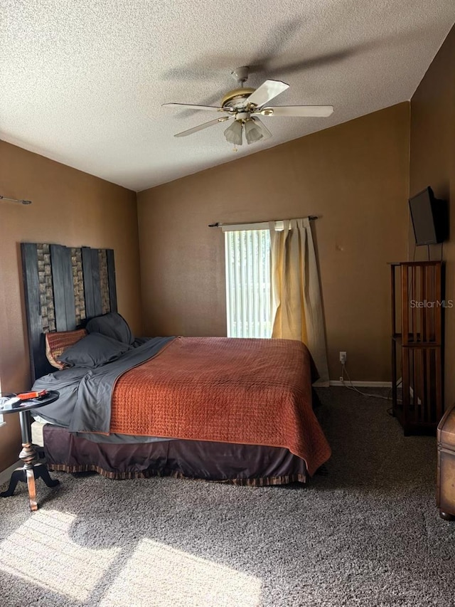 carpeted bedroom with ceiling fan, lofted ceiling, and a textured ceiling